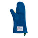 A blue Tucker Safety oven mitt with a yellow label.