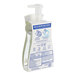 A plastic bottle of Dial White Tea foaming hand soap with a pump and label.