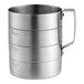 A metal measuring cup with measurements for 3 different quantities.