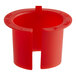 A red plastic ServIt conduit bushing on a counter.