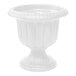 A white urn planter with a round pedestal.