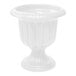 A white urn planter with a round pedestal.