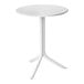 A Nardi Spritz round table with adjustable dual height in white with a white base and legs.