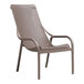 A Net Lounge chair in a tan woven fabric with a mesh back.