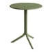 A Nardi round agave table with a metal base and legs.