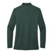 A back view of a women's dark green long sleeve Port Authority polo shirt.