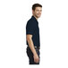 A person wearing a Port Authority River Blue and Navy polo shirt.