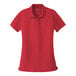 A Port Authority women's rich red short sleeve polo shirt.