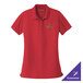 A rich red Port Authority short sleeve polo shirt with a green logo.