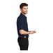 A man in a navy Port Authority® silk touch pique polo shirt.