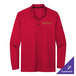 A red Nike long sleeve polo shirt with gold embroidery.