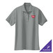 A Port Authority women's cool gray polo shirt with a logo on it.