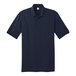 A dark blue Port & Company polo shirt with short sleeves.