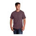A man smiling and wearing a Port & Company heather athletic maroon short sleeve T-shirt.