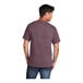 A man wearing a Port & Company heather maroon t-shirt.