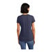 A woman wearing a dark blue District t-shirt.