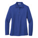 A medium royal blue Port Authority long sleeve polo shirt for women.