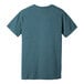 A close-up of the back of a blue Bella + Canvas t-shirt with a white logo.