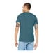 A man wearing a heather slate Bella + Canvas t-shirt.
