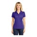 A woman wearing a purple Sport-Tek short sleeve polo shirt.