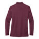 A Port Authority women's long sleeve polo shirt in burgundy.