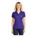 A woman wearing a purple Sport-Tek short sleeve polo shirt.