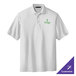 A white Port Authority polo shirt with a green logo.