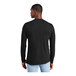 A man wearing a black District long sleeve t-shirt.