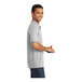 A man wearing a Port & Company ash polo shirt.