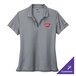 A Nike women's cool gray Dri-FIT polo shirt with a logo on it.