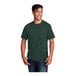 A man wearing a dark green Port & Company short sleeve t-shirt.