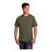 A man smiling and wearing a Port & Company olive drab green cotton T-shirt.