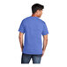 A man wearing a Port & Company heather royal blue t-shirt.