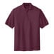 A Port Authority® maroon short sleeve silk touch pique polo shirt.