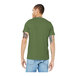 A man wearing a heather green Bella + Canvas customizable t-shirt.