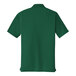 A deep forest green Port Authority polo shirt.