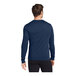 A man wearing a Nike College Navy long sleeve shirt.