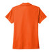 An orange Polo Nike short sleeve shirt with an embroidered logo on the front.