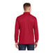 A man wearing a deep red Sport-Tek long sleeve polo shirt.