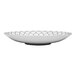 A white Libbey deep coupe plate with a black geometric design on the rim.