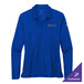 A blue Nike women's long sleeve polo shirt on a table.