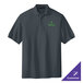 A Port Authority steel gray polo shirt with a logo on it.