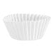 A close-up of a white fluted mini baking cup on a white background.