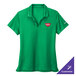 A Nike lucid green short sleeve polo shirt with a logo on it.