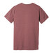 The back of a heather mauve t-shirt with a small logo on the front.