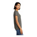 A woman wearing a District women's grey short sleeve T-shirt.