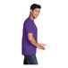 A man wearing a Port & Company team purple short sleeve t-shirt.