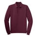 A Port Authority® burgundy long sleeve polo shirt.