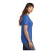 A woman wearing a royal blue Port & Company short sleeve v-neck t-shirt.