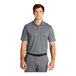 A man wearing a grey Nike Dri-Fit polo shirt with a collar.